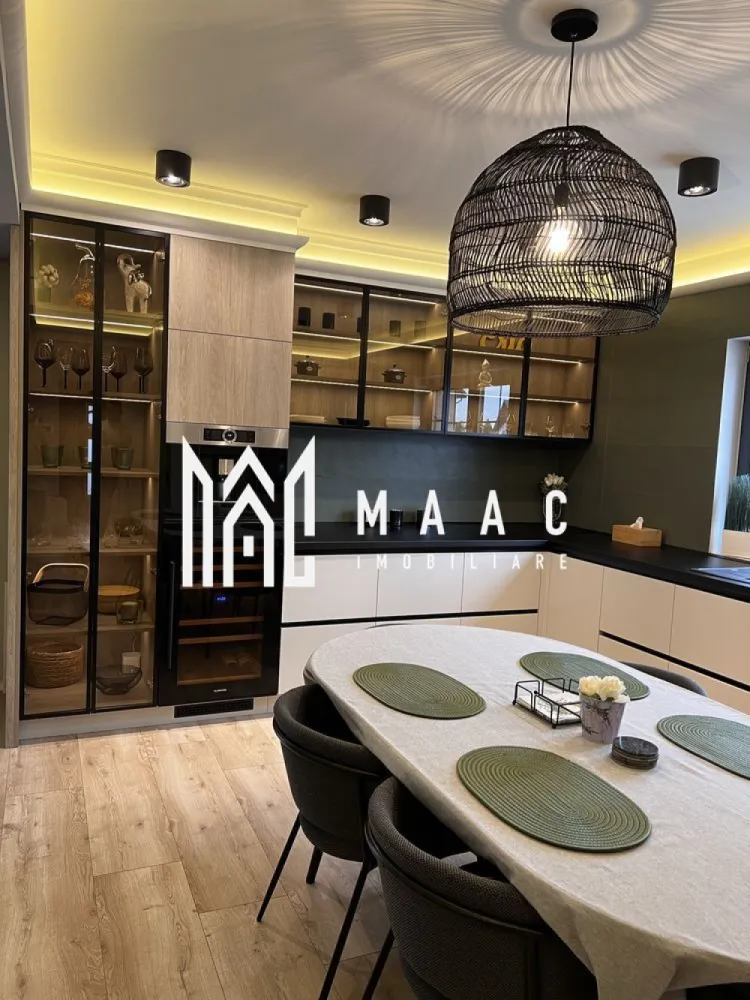 Duplex | 210 mp | Curte 200 mp | 5 Camere | 3 Băi | Șelimbăr - MAAC Imobiliare vă propune spre vânzare o casă spațioasă și elegantă, ideală pentru o familie care își dorește confort, funcționalitate și un ambient modern, bine organizat. Proprietatea beneficiază de o suprafață utilă de 211 mp și o curte de aproximativ 200 mp, oferind un echilibru optim între spațiul interior generos și zona exterioară dedicată relaxării.

Locuința este compartimentată inteligent, cu încăperi luminoase și bine dimensionate, fiind potrivită atât pentru locuire permanentă, cât și pentru investiție pe termen lung. Se vinde complet mobilată și utilată, cu finisaje de calitate, gata pentru mutare imediată fără necesitatea unor investiții suplimentare.

Compartimentare:
-5 camere spațioase, ideale pentru living, dormitoare sau birou
-dressing generos de 14 mp
-3 băi moderne, amenajate cu atenție la detalii

Exterior:
-curte privată de aproximativ 200 mp, ideală pentru relaxare sau amenajare spațiu verde
-carport pentru protecția mașinii

Proprietatea se evidențiază prin suprafețele generoase, compartimentarea practică și atmosfera primitoare, fiind o alegere excelentă pentru cei care caută o locuință complet echipată într-un cadru confortabil.

Pentru mai multe detalii, vă rugăm să menționați CP2988696 la telefon.