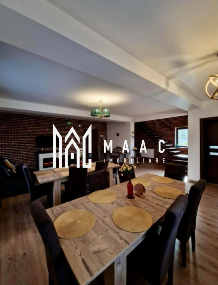 Pensiune Turistică | 360MPU | Curte | Oportunitate Investiție | Porumbacu de Sus - MAAC Imobiliare vă propune spre vânzare o pensiune / casă de vacanță complet funcțională, situată în Porumbacu de Sus, una dintre cele mai apreciate zone turistice din județul Sibiu, o proprietate cu activitate solidă de peste 4 ani și flux constant de turiști, pregătită pentru preluare imediată.

Construită în anul 2021 și menținută impecabil, proprietatea oferă o suprafață utilă de 360 mp, fiind organizată eficient pentru desfășurarea activităților turistice:

-clădire principală dispusă pe parter, etaj și pod mansardat
-5 unități de cazare, fiecare cu baie proprie și balcon
-un apartament, o cameră triplă și trei camere duble

Spațiile sunt luminoase, bine întreținute și adaptate cerințelor actuale din turism:
-living generos

-bucătărie complet utilată

-6 dormitoare

-6 băi

-terasă de aproximativ 20 mp

În exterior, proprietatea oferă facilități apreciate de turiști:
-bucătărie de vară
-foișor
-zonă de barbecue

Dotări tehnice și utilități:
-încălzire centrală pe peleți
-izolație exterioară de 10 cm
-acoperiș Bilka
-alimentare cu apă din rețea și fântână proprie
-contor trifazic

Proprietatea este amplasată pe un teren de 1.000 mp, dintre care aproximativ 900 mp reprezintă curte liberă, oferind posibilitatea extinderii cu facilități suplimentare precum saună, ciubăr sau noi spații de cazare.

În partea din spate a terenului se află o cabană secundară din lemn, de aproximativ 50 mp, dispusă P+M, locuibilă, ce necesită renovare și oferă potențial pentru extinderea capacității sau proiecte independente.

Curtea dispune de:
-6–7 locuri de parcare
-acces facil
-cadru natural liniștit

Poziționarea este un avantaj major, datorită proximității față de obiective turistice importante și trasee montane, ceea ce asigură vizibilitate și cerere constantă pe tot parcursul anului.

Proprietatea este ideală pentru investitori în turism, familii care doresc o afacere funcțională sau pentru dezvoltarea unui mini-complex turistic.

Pentru mai multe detalii și vizionarea acestei proprietăți /oportunități de investiție ,contactați-ne și specificați codul de identificare al proprietății ID: CP2819284