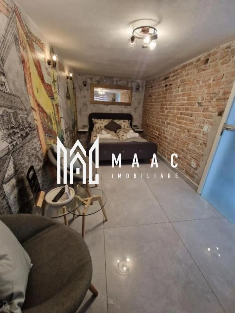 Garsonieră decomandată | Ultracentral Sibiu | 21 mp, finisată modern - Garsonieră decomandată de vânzare pe Strada Movilei, în zona Ultracentral din Sibiu, cu 21 mp utili și finisaje moderne. Proprietatea este finalizată, renovată integral, complet mobilată și utilată, pregătită pentru utilizare imediată.

Detalii proprietate:
• Suprafață utilă: 21 mp
• Compartimentare: decomandată
• Stadiu interior: finisat modern
• Construcție finalizată
• Structură din cărămidă
• Se vinde complet mobilată și utilată
• Renovată integral

Proprietatea este situată pe Strada Movilei, în zona Ultracentrală a Sibiului, cu acces rapid către punctele de interes din oraș.

Contactați-ne pentru detalii suplimentare și pentru programarea unei vizionări. Cod anunț CP2995664.