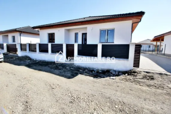Casa 4 cam.2 băi,1 pivniță 1 dressing,500mp.teren,gard,pavaj