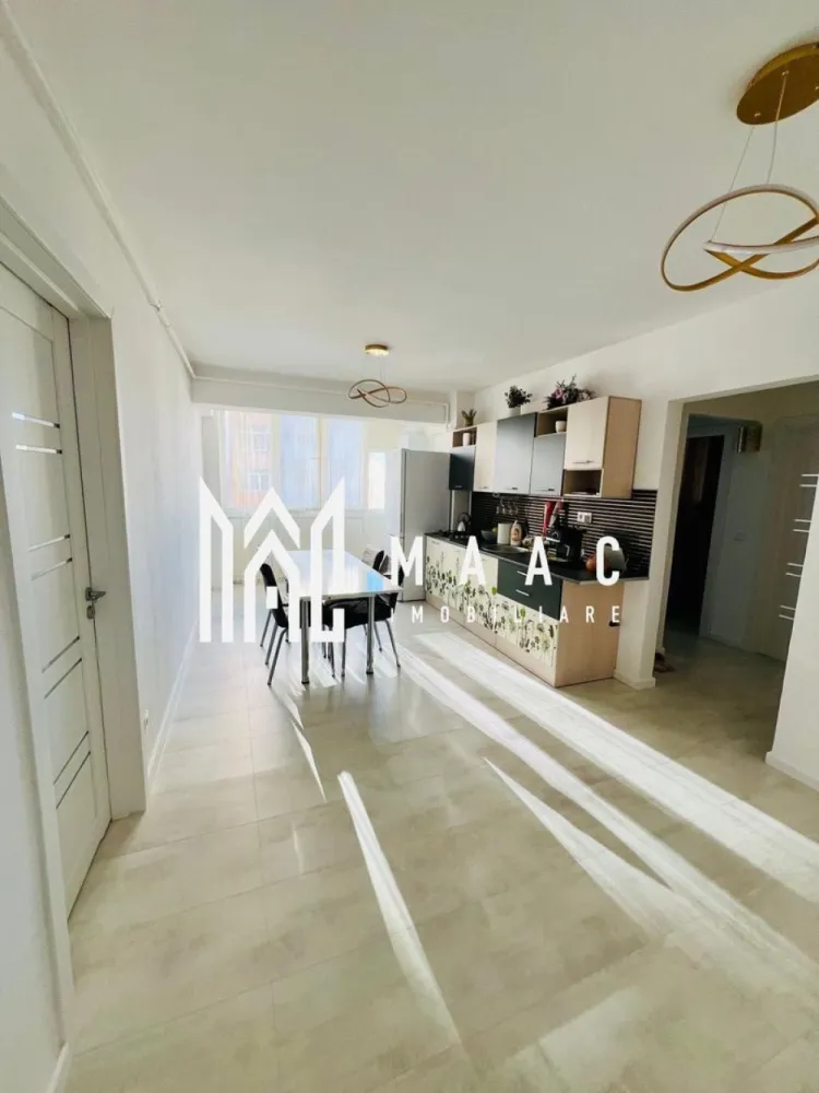 Apartament 3 camere | Lift | 70MPU | Vasile Aron - MAAC Imobiliare vă propune spre închiriere / vânzare un apartament decomandat cu 3 camere, situat la etajul 5 al unui imobil dotat cu lift, ideal pentru cei care își doresc un spațiu bine compartimentat, luminos și ușor de personalizat după propriul stil.

Locuința are o suprafață utilă de 70 mp și se află într-un bloc construit în perioada 1990–2000, beneficiind de o compartimentare practică și de un interior modern.

Compartimentare:
Living generos
Doua dormitoare nemobilate
Bucătărie mobilată și utilată
Baie
Debară

Avantaje:
Decomandat
3 camere
70 mp utili
Bloc cu lift
Bloc construit în perioada 1990–2000
Interior modern
Bucătărie complet mobilată și utilată
2 dormitoare nemobilate – ideale pentru personalizare

Pentru mai multe detalii sau programarea unei vizionări, nu ezitați să ne contactați specificand ID: CP3008998