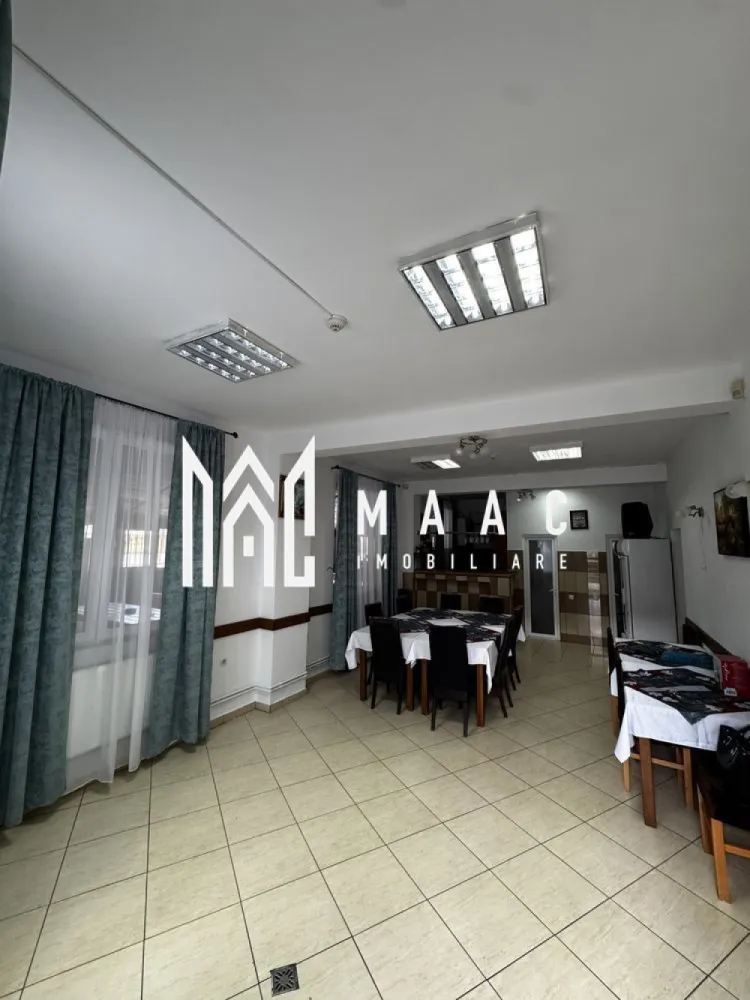 Pensiune de Vanzare | 400 MP | Zona Viile Sibiului - MAAC Imobiliare va propune spre vânzare o pensiune , într-o zonă liniștită și ușor accesibilă, ideală pentru cei care doresc o investiție sigură și profitabilă în domeniul turismului sau închirierea pe termen lung.

Imobilul se află într-o zonă retrasă, dar în același timp aproape de oraș, oferind acces rapid către principalele puncte de interes și obiective turistice din Sibiu. Locația este perfectă pentru turiști, datorită liniștii și peisajului specific zonei Viile Sibiului.

Pensiunea dispune de o compartimentare excelentă, gândită pentru confort și funcționalitate:
• 8 dormitoare, fiecare cu baie proprie și balcon
• Bucătărie complet utilată
• Restaurant amenajat și funcțional
• Bar
• Terasă închisă, utilizabilă pe tot parcursul anului
• 2 grupuri sanitare suplimentare
• 4 spații de depozitare / magazii
• Parcare proprie

Proprietatea a fost renovată recent, fiind dotată complet și pregătită pentru preluare imediată. Se poate continua activitatea turistică actuală, preluând și conceptul de business existent.

Pentru mai mute detalii sau o vizionare specificati ID:CP2804309