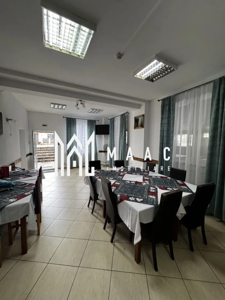 Pensiune de Vanzare | 400 MP | Zona Viile Sibiului - MAAC Imobiliare va propune spre vânzare o pensiune , într-o zonă liniștită și ușor accesibilă, ideală pentru cei care doresc o investiție sigură și profitabilă în domeniul turismului sau închirierea pe termen lung.

Imobilul se află într-o zonă retrasă, dar în același timp aproape de oraș, oferind acces rapid către principalele puncte de interes și obiective turistice din Sibiu. Locația este perfectă pentru turiști, datorită liniștii și peisajului specific zonei Viile Sibiului.

Pensiunea dispune de o compartimentare excelentă, gândită pentru confort și funcționalitate:
• 8 dormitoare, fiecare cu baie proprie și balcon
• Bucătărie complet utilată
• Restaurant amenajat și funcțional
• Bar
• Terasă închisă, utilizabilă pe tot parcursul anului
• 2 grupuri sanitare suplimentare
• 4 spații de depozitare / magazii
• Parcare proprie

Proprietatea a fost renovată recent, fiind dotată complet și pregătită pentru preluare imediată. Se poate continua activitatea turistică actuală, preluând și conceptul de business existent.

Pentru mai mute detalii sau o vizionare specificati ID:CP2804309