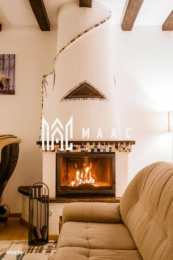 Casa 4 camere | 203 MPU | 1300 MP Teren | Tocile - MAAC Imobiliare vă propune spre vânzare o proprietate deosebită, situată la doar 15 km de Sibiu, ideală pentru cei care își doresc confort, siguranță structurală și o locație retrasă, cu vedere panoramică către Munții Făgăraș.
Această casă unică, construită în anul 2015, impresionează atât prin calitatea construcției și dotările moderne, cât și prin amplasarea privilegiată, pe o stradă liniștită, ferită de agitația urbană.

Informații tehnice:
Suprafață desfășurată: 203 mp

Structură mixtă:
Parter construit din beton armat monolit – rezistență seismică ridicată
Etaj din structură modulară integrală din lemn – eficiență energetică sporită
Termoizolație: termosistem de 20 cm
Teren: 1300 mp (cu posibilitate de extindere cu încă 550 mp)
Rezistență seismică: proiectată pentru cutremure > 7,5 grade Richter

Compartimentare și facilități:
Zona de zi:
Living cu zonă de cooking & dining adiacentă – spațiu generos, ideal pentru relaxare și socializare, cu priveliște spectaculoasă asupra Munților Făgăraș
Demisol complet utilat cu:
Bucătărie de vară
Spălătorie
Cameră tehnică
Crama

Zona de noapte:
3 dormitoare (inclusiv un dormitor matrimonial cu dressing propriu)
2 băi moderne
Hol spațios

Dotări exterioare:
Filigorie amenajată complet – cuptor de pizza, grătar, încălzitor, grup sanitar și spațiu de depozitare
Curte generoasă, ideală pentru relaxare, grădinărit sau amenajări suplimentare

Utilități și sisteme autonome:
Proprietatea beneficiază de toate utilitățile necesare unui trai modern, completate de sisteme autonome și independente, ce asigură confort, eficiență și independență energetică.

Localizare:
Situată într-o zonă liniștită, la aproximativ 15 km de centrul Sibiului, proprietatea oferă acces rapid la facilitățile urbane, păstrând în același timp intimitatea și liniștea unei zone rezidențiale retrase.

Detalii suplimentare:
Posibilitate extindere teren cu 550 mp – negociabil separat
Proprietatea se vinde exact cum este prezentată, cu toate dotările existente
Ideală pentru locuință permanentă, reședință de vacanță sau business turistic

Pentru mai multe informații sau pentru a programa o vizionare, vă rugăm să ne contactați telefonic.
Menționați ID-ul CP2614592 pentru a primi detalii suplimentare despre această proprietate unică din portofoliul nostru.