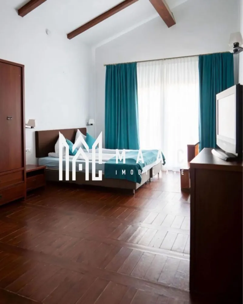 Pensiune turistică 5★ de vânzare în Băile Olănești | Proprietate premium - MAAC IMOBILIARE vă propune spre vânzare o proprietate deosebită, situată în stațiunea Băile Olănești, una dintre cele mai apreciate destinații turistice din România, renumită pentru aerul curat și izvoarele sale minerale.
Această vilă turistică clasificată la standard de 5★ reprezintă alegerea ideală atât pentru o afacere profitabilă în domeniul turismului, cât și pentru o casă de vacanță exclusivistă sau locuință permanentă, fiind situată la doar aproximativ 35 de minute de Râmnicu Vâlcea.
Proprietatea este amplasată pe un teren generos de 850 mp, având o suprafață construită de 200 mp și o arie desfășurată de 300 mp, fiind compartimentată eficient pentru confort și funcționalitate.
Compartimentare și dotări:
6 camere spațioase, amenajate modern
Living generos, ideal pentru relaxare
Bucătărie complet echipată
Terasă exterioară cu grătar
Zonă de șezlonguri pentru relaxare
Facilități premium:
Piscină exterioară
Saună
Jacuzzi
Șemineu tip centrală în living
Confort și utilități:
Centrală pe lemne
Centrală electrică
Toate utilitățile disponibile
Proprietatea este perfect adaptată pentru a funcționa imediat ca pensiune turistică la cheie, beneficiind deja de clasificare oficială, dar oferă în același timp intimitatea și confortul unei locuințe private într-un cadru natural deosebit.
Datorită poziționării excelente și facilităților de top, această vilă reprezintă o investiție sigură și profitabilă, într-o zonă cu cerere turistică ridicată pe tot parcursul anului.
Pentru mai multe detalii și programări la vizionare, echipa MAAC IMOBILIARE vă stă la dispoziție!
CP3029231