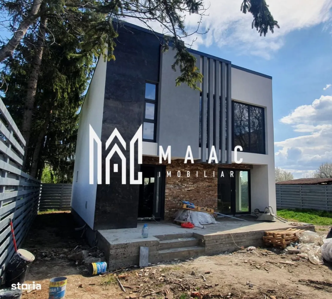 Casă modernă LOW-E | Independentă energetic | Construcție la comandă - MAAC Imobiliare vă propune un concept de locuință modernă LOW-E, cu consum redus de energie și posibilitate de independență energetică, disponibilă pentru construcție oriunde în România sau Europa (terenul nu este inclus).

 Detalii model
Suprafață utilă: 145 mp
Regim: Parter + Etaj
Predare: la cheie (finisată complet, nemobilată)
Compartimentare flexibilă (pereți interiori neportanți)
 Compartimentare
Parter:
Hol acces
Living + bucătărie open space (49 mp)
Baie cu duș
Cămară
Etaj:
Dormitor matrimonial
2 dormitoare
Baie cu cadă
Dressing
 Dotări & tehnologii premium
Pompa de căldură aer-apă (clasa A+++) – încălzire și răcire eficientă
Încălzire în pardoseală pe ambele niveluri
Sistem smart home (control de la distanță)
Sistem de alarmă + antiincendiu
Pregătire pentru camere video și videointerfon
Ferestre premium REHAU Artevo Fipro, tripan, înălțime 2.4 m
Izolație performantă PIR (120 mm pereți / 200 mm acoperiș)
Acoperiș plat cu membrană EPDM (garanție 30 ani)
Iluminat ambiental exterior modern
 Finisaje incluse
Parchet / gresie la alegere
Uși interioare și ușă de intrare premium
Băi complet echipate (obiecte sanitare + mobilier)
Pereți finisați cu lavabilă
Scară interioară finisată cu lemn și iluminare LED
Terasă exterioară finisată (WPC sau plăci ceramice)
 Avantaje
Costuri foarte reduse de întreținere
Posibilitate de personalizare completă
Design modern, tip cubic
Execuție rapidă: aprox. 6 luni
Plata etapizată, sigură pentru client
 Opțiuni suplimentare
Pachet LOW-E avansat (izolație extinsă)
Panouri fotovoltaice + baterii
Piscină, jacuzzi, saună, sală fitness
Garaj / copertină auto
Fațadă ventilată premium (Alucobond / HPL)
 Preț
195.000 € (TVA inclus)
Promo: 159.000 € (TVA inclus) – ofertă limitată

TERENUL NU ESTE INCLUS

📞 Contactează-ne pentru detalii complete și ofertă personalizată, menționați CP2969419!