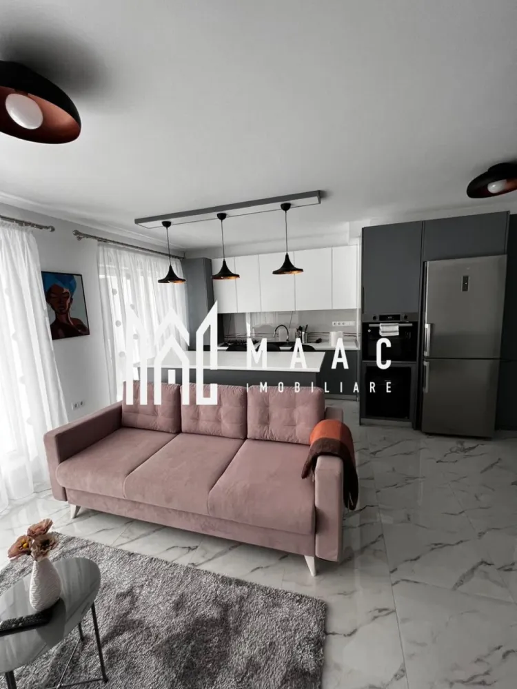 Apartament 3 camere | Terasă 12 MP | Parcare | Turnisor - MAAC Imobiliare va propune spre vanzare un apartament modern cu 3 camere, situat într-un bloc nou din Cartierul Kogălniceanu, la doar câțiva pași de centrul orașului — o locație excelentă pentru cei care își doresc confort, eleganță și acces rapid către toate punctele de interes.

Cu o suprafață utilă de 71 mp, la care se adaugă o terasă generoasă de 12 mp, proprietatea impresionează prin designul contemporan, compartimentarea inteligentă și finisajele premium.

Compartimentare:
living spațios open-space cu bucătărie modernă și insulă
2 dormitoare luminoase
1 baie elegant amenajată
terasă spațioasă de 12 mp, ideală pentru relaxare

Dotări și beneficii:
încălzire în pardoseală
aer condiționat
electrocasnice moderne de ultimă generație
frigider dedicat pentru vinuri
finisaje premium
mobilier premium realizat la comandă
se vinde complet mobilat și utilat
loc de parcare inclus
bloc nou

Apartamentul este ideal atât pentru locuit, cât și pentru investiție, datorită poziționării excelente în una dintre cele mai apreciate zone rezidențiale, aproape de centru, restaurante, cafenele, școli și zone de promenadă.

Dacă îți dorești un apartament „la cheie”, amenajat cu bun gust și atenție la fiecare detaliu, această proprietate este alegerea perfectă.
Pentru mai multe detalii și programarea unei vizionări, vă rugăm să ne contactați telefonic și să menționați CP2985963.