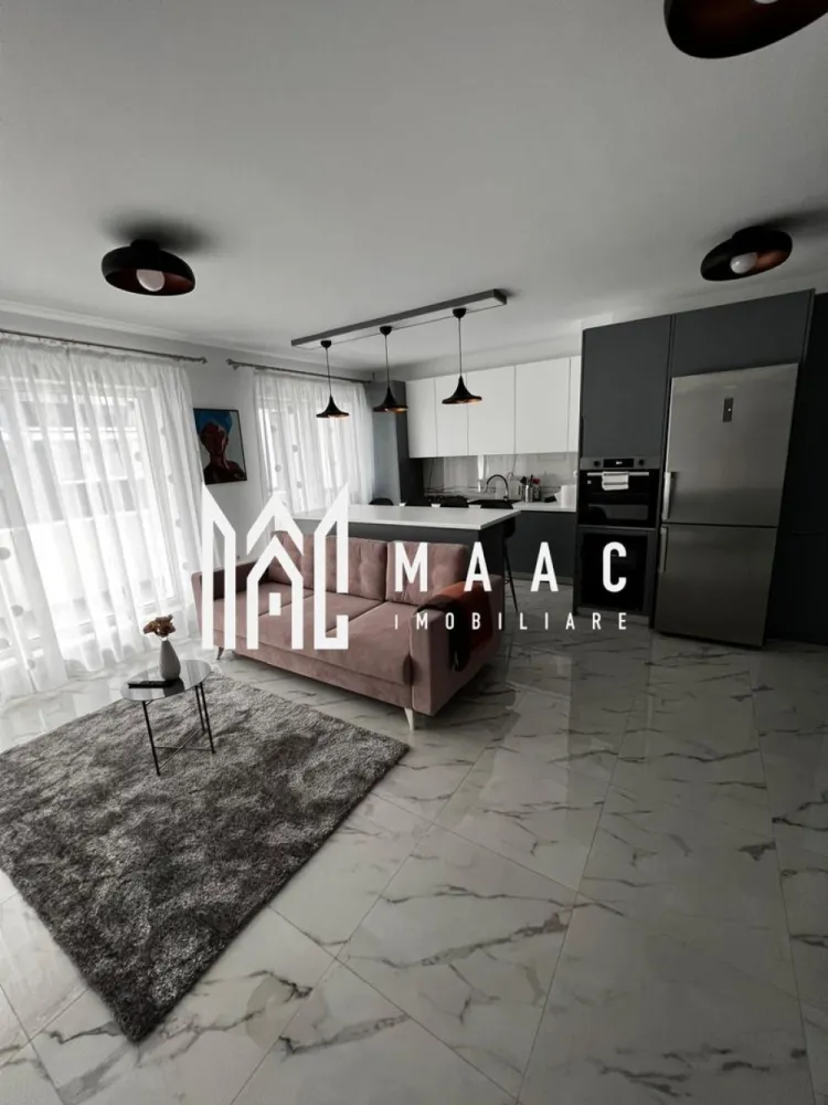 Apartament 3 camere | Terasă 12 MP | Parcare | Turnisor - MAAC Imobiliare va propune spre vanzare un apartament modern cu 3 camere, situat într-un bloc nou din Cartierul Kogălniceanu, la doar câțiva pași de centrul orașului — o locație excelentă pentru cei care își doresc confort, eleganță și acces rapid către toate punctele de interes.

Cu o suprafață utilă de 71 mp, la care se adaugă o terasă generoasă de 12 mp, proprietatea impresionează prin designul contemporan, compartimentarea inteligentă și finisajele premium.

Compartimentare:
living spațios open-space cu bucătărie modernă și insulă
2 dormitoare luminoase
1 baie elegant amenajată
terasă spațioasă de 12 mp, ideală pentru relaxare

Dotări și beneficii:
încălzire în pardoseală
aer condiționat
electrocasnice moderne de ultimă generație
frigider dedicat pentru vinuri
finisaje premium
mobilier premium realizat la comandă
se vinde complet mobilat și utilat
loc de parcare inclus
bloc nou

Apartamentul este ideal atât pentru locuit, cât și pentru investiție, datorită poziționării excelente în una dintre cele mai apreciate zone rezidențiale, aproape de centru, restaurante, cafenele, școli și zone de promenadă.

Dacă îți dorești un apartament „la cheie”, amenajat cu bun gust și atenție la fiecare detaliu, această proprietate este alegerea perfectă.
Pentru mai multe detalii și programarea unei vizionări, vă rugăm să ne contactați telefonic și să menționați CP2985963.