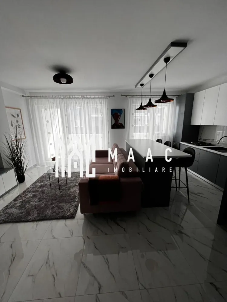 Apartament 3 camere | Terasă 12 MP | Parcare | Turnisor - MAAC Imobiliare va propune spre vanzare un apartament modern cu 3 camere, situat într-un bloc nou din Cartierul Kogălniceanu, la doar câțiva pași de centrul orașului — o locație excelentă pentru cei care își doresc confort, eleganță și acces rapid către toate punctele de interes.

Cu o suprafață utilă de 71 mp, la care se adaugă o terasă generoasă de 12 mp, proprietatea impresionează prin designul contemporan, compartimentarea inteligentă și finisajele premium.

Compartimentare:
living spațios open-space cu bucătărie modernă și insulă
2 dormitoare luminoase
1 baie elegant amenajată
terasă spațioasă de 12 mp, ideală pentru relaxare

Dotări și beneficii:
încălzire în pardoseală
aer condiționat
electrocasnice moderne de ultimă generație
frigider dedicat pentru vinuri
finisaje premium
mobilier premium realizat la comandă
se vinde complet mobilat și utilat
loc de parcare inclus
bloc nou

Apartamentul este ideal atât pentru locuit, cât și pentru investiție, datorită poziționării excelente în una dintre cele mai apreciate zone rezidențiale, aproape de centru, restaurante, cafenele, școli și zone de promenadă.

Dacă îți dorești un apartament „la cheie”, amenajat cu bun gust și atenție la fiecare detaliu, această proprietate este alegerea perfectă.
Pentru mai multe detalii și programarea unei vizionări, vă rugăm să ne contactați telefonic și să menționați CP2985963.