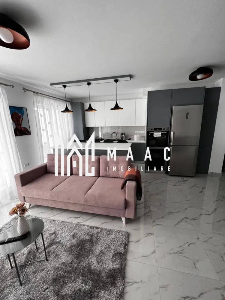 Apartament 3 camere | Terasă 12 MP | Parcare | Turnisor - MAAC Imobiliare va propune spre vanzare un apartament modern cu 3 camere, situat într-un bloc nou din Cartierul Kogălniceanu, la doar câțiva pași de centrul orașului — o locație excelentă pentru cei care își doresc confort, eleganță și acces rapid către toate punctele de interes.

Cu o suprafață utilă de 71 mp, la care se adaugă o terasă generoasă de 12 mp, proprietatea impresionează prin designul contemporan, compartimentarea inteligentă și finisajele premium.

Compartimentare:
living spațios open-space cu bucătărie modernă și insulă
2 dormitoare luminoase
1 baie elegant amenajată
terasă spațioasă de 12 mp, ideală pentru relaxare

Dotări și beneficii:
încălzire în pardoseală
aer condiționat
electrocasnice moderne de ultimă generație
frigider dedicat pentru vinuri
finisaje premium
mobilier premium realizat la comandă
se vinde complet mobilat și utilat
loc de parcare inclus
bloc nou

Apartamentul este ideal atât pentru locuit, cât și pentru investiție, datorită poziționării excelente în una dintre cele mai apreciate zone rezidențiale, aproape de centru, restaurante, cafenele, școli și zone de promenadă.

Dacă îți dorești un apartament „la cheie”, amenajat cu bun gust și atenție la fiecare detaliu, această proprietate este alegerea perfectă.
Pentru mai multe detalii și programarea unei vizionări, vă rugăm să ne contactați telefonic și să menționați CP2985963.