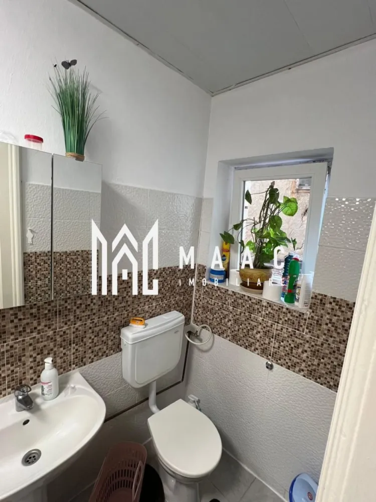 Apartament la casă I Ultracentral | 67 MPU | Curte și grădină - MAAC Imobiliare va propune spre vanzare un apartament la casă, situat ultracentral în Sibiu, cu o suprafață utilă de 67 mp – alegerea ideală pentru cei care își doresc confort, intimitate și acces rapid la toate facilitățile orașului.

Apartamentul este bine compartimentat și luminos, fiind compus din:

2 camere spațioase
bucătărie separată cu cămară
baie
toaletă de serviciu

În plus, proprietatea beneficiază de:

pivniță – spațiu excelent pentru depozitare
anexă (curte)
grădină – perfectă pentru relaxare
spălătorie

Locuința oferă un spațiu versatil, potrivit atât pentru locuit, cât și pentru investiție, fiind pregătită pentru mutare imediată.

Avantaje cheie:

locație centrală premium – totul la câțiva pași
acces rapid către principalele puncte de interes din oraș
potențial ridicat de investiție
ideal pentru regim hotelier sau închiriere pe termen lung

Fie că îți dorești o locuință în centrul orașului sau o investiție sigură, această proprietate reprezintă o oportunitate excelentă.

Pentru mai multe detalii și programarea unei vizionări, vă invităm să contactați Maac Imobiliare, specificând ID: CP3021537.