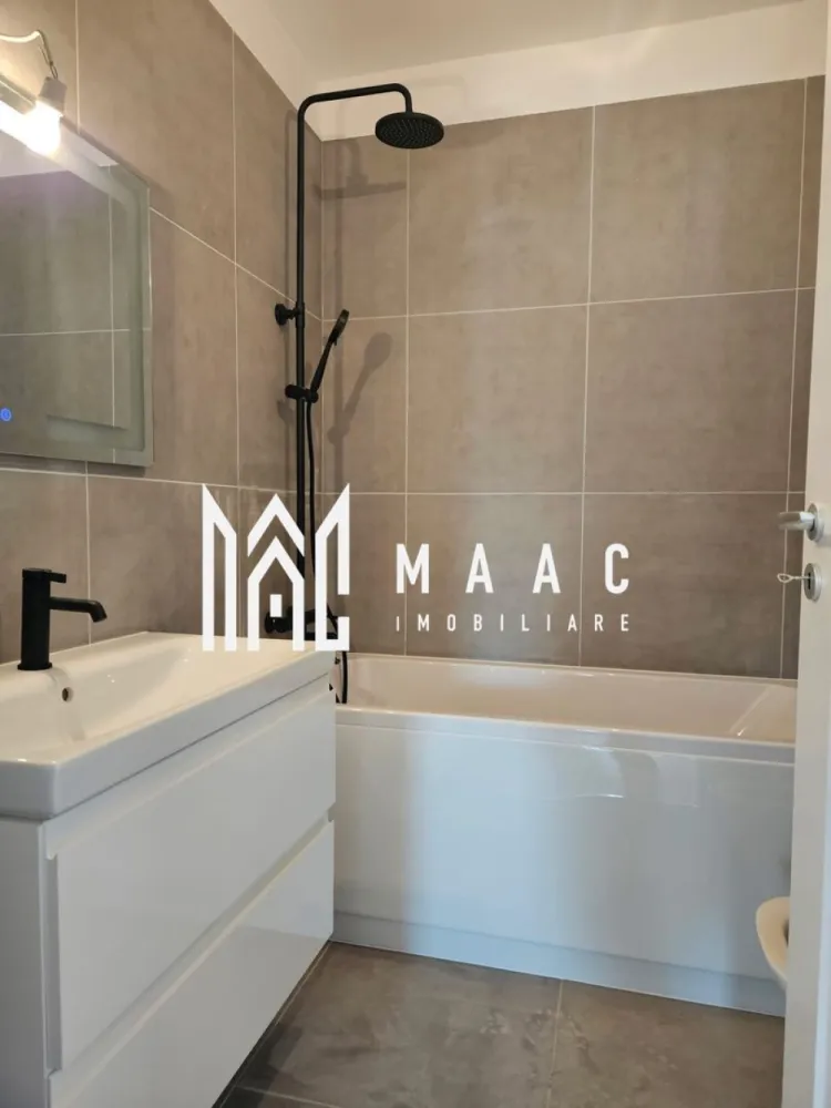 Apartament 2 Camere I Sibiu I Doamna Stanca I Balcon I Parcare Inclusă - MAAC Imobiliare vă propune spre vânzare un apartament modern cu 2 camere, situat pe Strada Doamna Stanca din Sibiu, într-o zonă rezidențială nouă, aflată în plină dezvoltare și tot mai apreciată pentru accesibilitate și facilitățile din apropiere. Proprietatea reprezintă o alegere excelentă atât pentru locuință proprie, cât și pentru investiție, datorită compartimentării eficiente, spațiilor generoase și poziționării într-un ansamblu rezidențial nou.

Apartamentul este conceput pentru a oferi confort și funcționalitate, având un living spațios cu bucătărie open-space, zone bine delimitate și un balcon generos, ideal pentru relaxare.

Compartimentare:
-Living + bucătărie: 29,61 mp
-Dormitor: 12,03 mp
-Baie: 4,51 mp
-Hol: 2,49 mp
-Balcon: 10,83 mp

Proprietatea este disponibilă în două variante de predare:
-97.500 euro (TVA inclus) – semifinisat
-103.700 euro (TVA inclus) – finisat la cheie

Dotări și beneficii:
-Loc de parcare exterior inclus
-Posibilitate achiziție parcare interioară – 10.900 euro
-Centrală termică
-Racordat la toate utilitățile
-Predare la cheie pentru varianta finisată
-Ansamblu rezidențial nou
-Compartimentare practică și luminoasă
-Balcon generos

Zona Doamna Stanca este una dintre cele mai căutate zone noi din Sibiu, oferind acces rapid către centre comerciale, magazine, școli, supermarketuri și principalele artere ale orașului. Apartamentul este potrivit pentru cei care caută un apartament nou în Sibiu, într-o zonă modernă, cu infrastructură în dezvoltare și acces facil către toate punctele de interes.

Pentru mai multe detalii vă rugăm să precizați telefonic că ați văzut anunțul cu CP3049402.