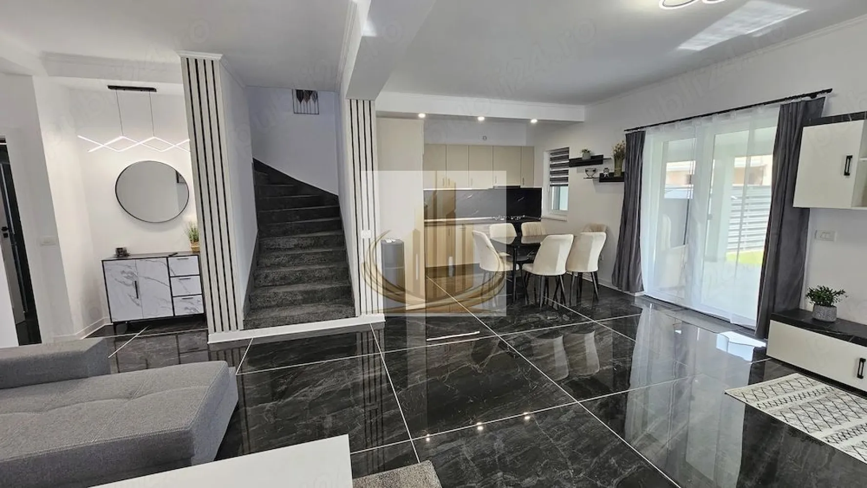 Duplex Modern | 150 mp utili | Curte 300 mp | 3 Parcări | Dumbrăvița - rand Mobilis Imobiliare vă propune spre închiriere o casă tip duplex, modernă și elegantă, situată în Dumbrăvița, într-o zonă liniștită, dar excelent conectată cu orașul.

Gândită pentru confort și funcționalitate, această locuință oferă spațiu generos, intimitate și un ambient plăcut, fiind alegerea ideală pentru un cuplu sau o familie care își dorește mai mult decât un simplu apartament.

📐 Caracteristici principale:
Suprafață utilă: 150 mp
Curte proprie: 300 mp, amenajată cu gazon
3 locuri de parcare în curte
Regim: Parter + Etaj + Pod (depozitare)
🏡 Compartimentare echilibrată:

Parter:

Dormitor / birou – ideal pentru work from home
Living spațios, luminos, cu zonă de dining
Bucătărie complet utilată
Baie
Hol

Etaj:

2 dormitoare generoase, fiecare cu dressing propriu
Baie

Pod:

Spațiu util pentru depozitare
🏢 Dotări care fac diferența:
Mobilier modern, locuință complet utilată
Centrală proprie + 2 aparate de aer condiționat
Jaluzele electrice la dormitoare
Poartă automată
Sistem de irigare automat + robot pentru gazon
Sistem de supraveghere video
Curte privată – perfectă pentru relaxare, familie sau animale
📍 Locație:
Zonă liniștită, ideală pentru locuit
În imediata apropiere: școli, grădinițe, magazine, farmacii
Restaurante și cafenele în zonă
Mijloace de transport în comun
Acces rapid către principalele artere ale orașului
💼 Pentru cine este:

✔️ Familii care își doresc spațiu, liniște și siguranță
✔️ Cupluri care caută confort și un stil de viață echilibrat
✔️ Ideal pentru cei care vor curte proprie fără compromisuri

💰 Preț: 1.099 €/lună
💳 Garanție: 600 €

📞 Pentru detalii și vizionări, echipa Grand Mobilis Imobiliare vă stă la dispoziție!
ID Intern: CP3060877