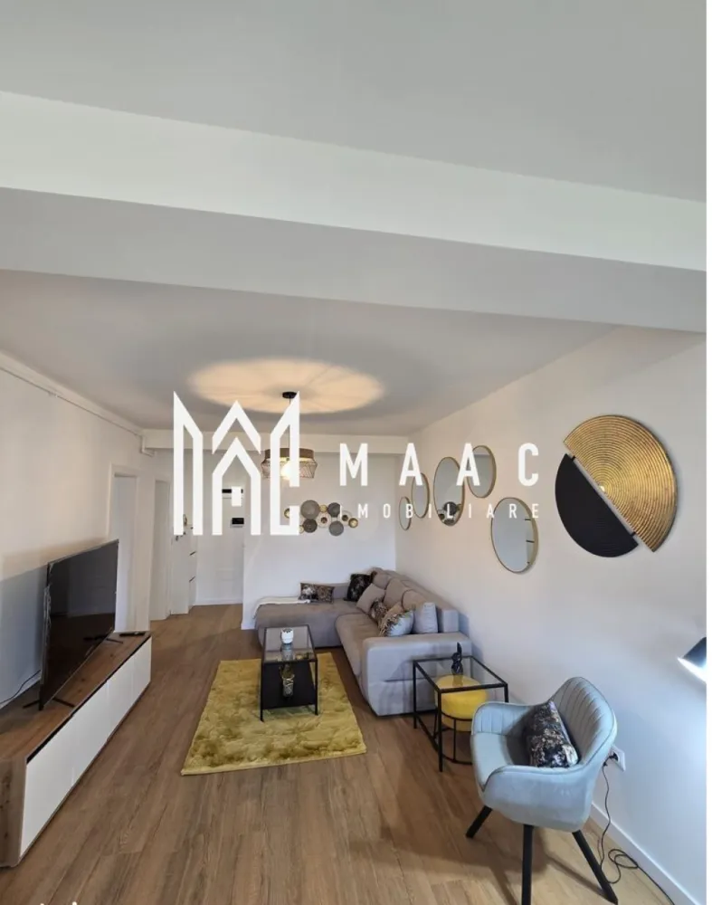 Apartament 2 Camere I Sibiu I DaVinci | Mobilat si Utilat - MAAC Imobiliare propune spre vânzare un apartament modern cu 2 camere, situat în cartierul DaVinci din Sibiu, una dintre cele mai căutate zone rezidențiale, cu cerere ridicată pentru închiriere.

Proprietatea reprezintă o oportunitate excelentă atât pentru locuit, cât și pentru investiție, având potențial foarte bun de închiriere datorită poziționării, calității construcției și dotărilor premium. Apartamentul se vinde complet mobilat și utilat, fiind pregătit pentru mutare sau închiriere imediată.

Caracteristici generale:
Suprafață utilă: 50 mp
Compartimentare: decomandat
Etaj: parter din 2
Imobil tip vilă, construcție din cărămidă
An construcție: 2025
Apartament intabulat
Loc de parcare inclus

Compartimentare:
Dormitor
Living cu bucătărie open space
Baie
Hol
2 terase cu pardoseală din granit și balustrade din sticlă
Balcon de 7 mp
Orientare sudică – apartament luminos

Dotări și finisaje:
Centrală termică proprie
Încălzire în pardoseală
Parchet, gresie, faianță de calitate
Terase amenajate cu granit
Storuri electrice exterioare
Videointerfon
Instalații sanitare moderne
Electrocasnice noi
Complet mobilat și utilat

Avantaje investiționale:
Zonă cu cerere ridicată pentru închiriere
Cartier modern, foarte căutat în Sibiu
Posibilitate de închiriere imediată fără investiții suplimentare
Randament atractiv datorită poziționării și dotărilor
Ideal pentru închiriere pe termen lung sau regim hotelier

Avantaje locație – DaVinci Sibiu:
Spații verzi generoase
Aer curat și liniște
Zonă rezidențială în plină dezvoltare
Acces facil către oraș

Apartament de vânzare în Sibiu, ideal pentru cumpărători care caută siguranță, confort și o investiție imobiliară profitabilă.

Pentru mai multe informații sau pentru programarea unei vizionări, vă rugăm să ne contactați și să menționați ID-ul proprietății: CP3062432.