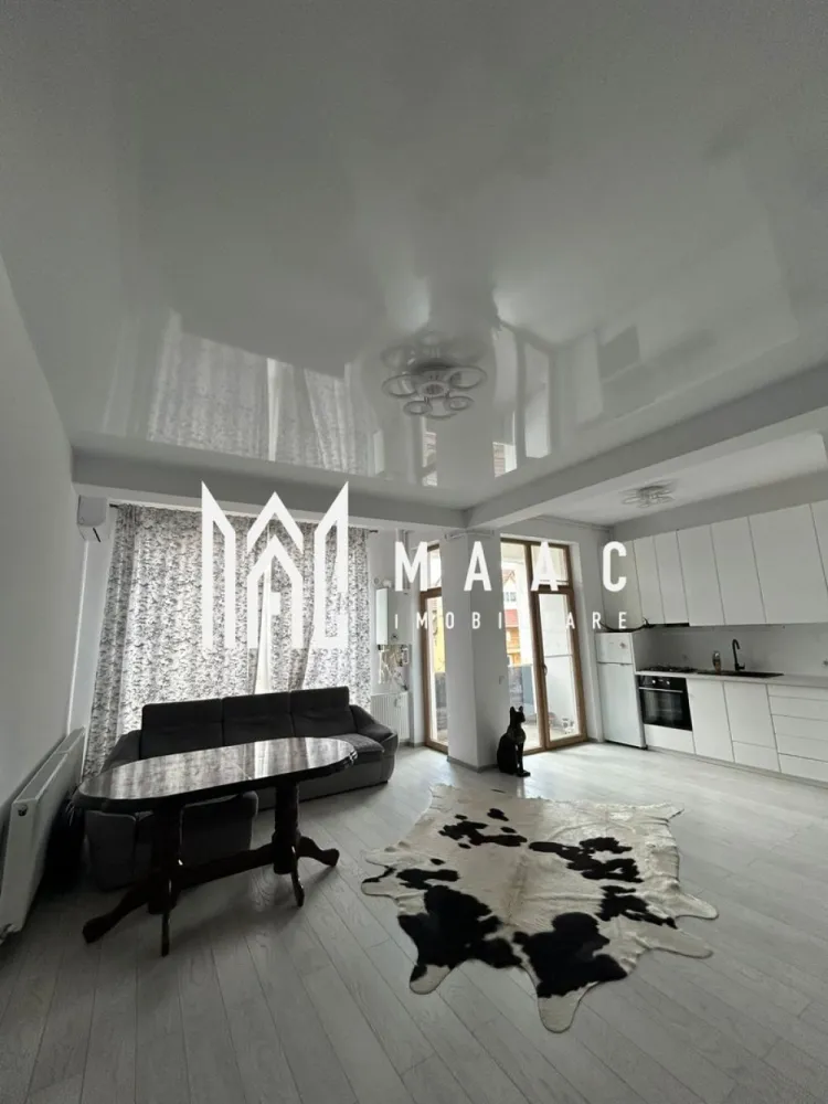 Apartament 2 camere I 55 mpu I Utilat I Parcare I Șelimbăr - MAAC Imobiliare propune spre vânzare un apartament situat chiar lângă mall-ul din Șelimbăr, o zonă excelentă atât pentru locuință proprie, cât și pentru investiție. 

Detalii apartament:
- suprafață utilă: 55 mp
- etaj: 1
- an construcție: 2021
- loc de parcare: inclus, amplasat sub balconul dormitorului

Compartimentare:
- living cu bucătărie open space
- dormitor
- baie
- 2 balcoane

Locuința este complet mobilată și utilată, cu electrocasnice noi, încă în garanție, televizoare OLED( unul de 195 cm), mobilier de bucătărie din MDF și mobilier pe comandă din lemn masiv în dormitor. Ușile interioare sunt de asemenea din lemn masiv, ceea ce conferă un plus de calitate și durabilitate. Spațiile sunt bine delimitate, iar zona este liniștită, cu toate facilitățile la îndemână.

Apartamentul se vinde exact cum se vede în poze, complet mobilat și utilat, fiind o variantă excelentă pentru cei care caută confort și accesibilitate într-o zonă premium.

Pentru mai multe detalii și pentru a programa o vizionare, contactați MAAC Imobiliare specificând ID CP2907622.
