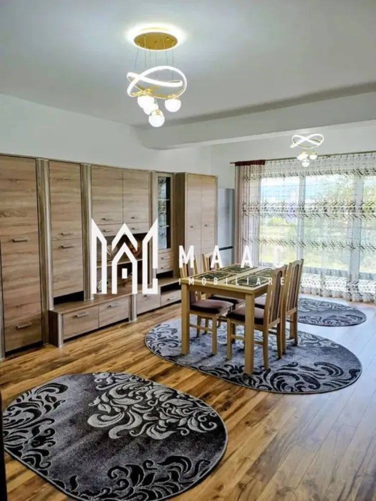 Apartament 1 Camera I 37MPU I Etaj 1 I Loc de parcare - MAAC Imobiliare vă propune spre închiriere o garsonieră modernă, situată la etajul 1 al unei vile cu 3 niveluri, în ansamblul rezidențial DaVinci Homes – una dintre cele mai căutate și apreciate zone din vestul Sibiului.

Locuința dispune de o suprafață utilă de 37 mp, la care se adaugă un balcon de 7,5 mp, perfect pentru momente de relaxare. Garsoniera se predă complet mobilată și utilată cu electrocasnice de ultimă generație:
centrală termică proprie cu încălzire în pardoseală,
plită mixtă și cuptor electric,
mașină de spălat vase,
mașină de spălat rufe cu uscător,
combină frigorifică, cuptor cu microunde,
Smart TV de 139 cm și jaluzele electrice.

Datorită orientării sudice, locuința este foarte luminoasă și economică, asigurând un nivel ridicat de confort termic și vizual. În prețul de închiriere este inclus și un loc de parcare privat, amplasat în fața imobilului.

Garsoniera este la prima închiriere și reprezintă o alegere ideală pentru o persoană sau un cuplu care își dorește confort, liniște și acces rapid către centrul orașului.

Detalii suplimentare:

Suprafață utilă: 37 mp + balcon 7,5 mp
Etaj: 1/3
Parcare privată inclusă
Primă închiriere
Complet mobilată și utilată
Orientare sudică
Pentru mai multe detalii și vizionări, precizati telefonic ca ati vazut anuntul cu ID:CP2785156