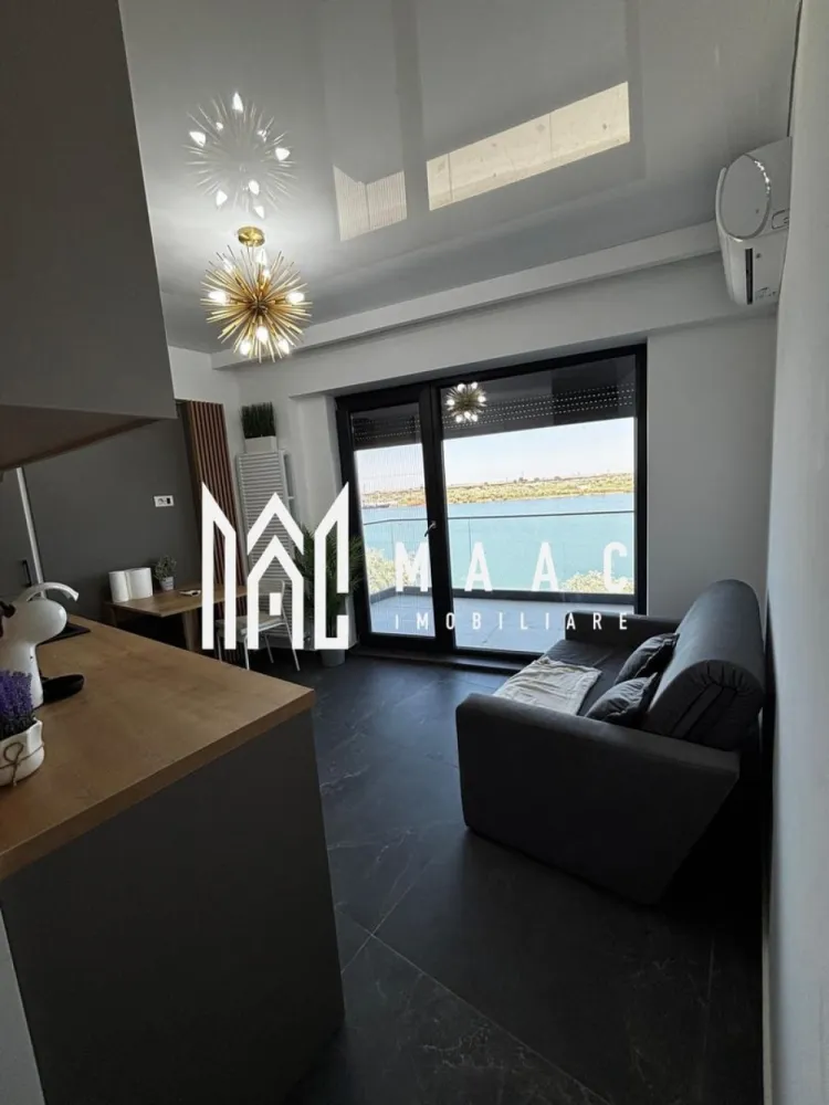 Apartament 2 camere | Vedere spre Mare | Etaj 2 - Apartament cu vedere la mare – Mamaia Nord | 45 mp | MAAC Imobiliare

MAAC Imobiliare vă propune spre vânzare un apartament superb situat în Mamaia Nord, cu vedere directă la mare, într-un bloc modern cu fațadă ventilată , construit la standarde premium.

Suprafață utilă:45 mp
Compartimentare:living cu bucătărie open-space, dormitor, baie, balcon
Vedere: panoramică spre mare

Dotări și avantaje:

* Mobilat și utilat complet, gata pentru locuire sau închiriere
* Aer condiționat
* Centrală proprie pe gaz
* Finisaje moderne, de calitate superioară
* Bloc cu fațadă ventilată – eficiență energetică și izolare excelentă
* Locație excelentă, la doar câțiva pași de plajă, restaurante și puncte de interes

 Ideal pentru:

* Locuință de vacanță
* Investiție profitabilă (închiriere sezonieră sau pe termen lung)

Pentru detalii suplimentare și programarea unei vizionări, contactați MAAC Imobiliare.

id-CP2781840