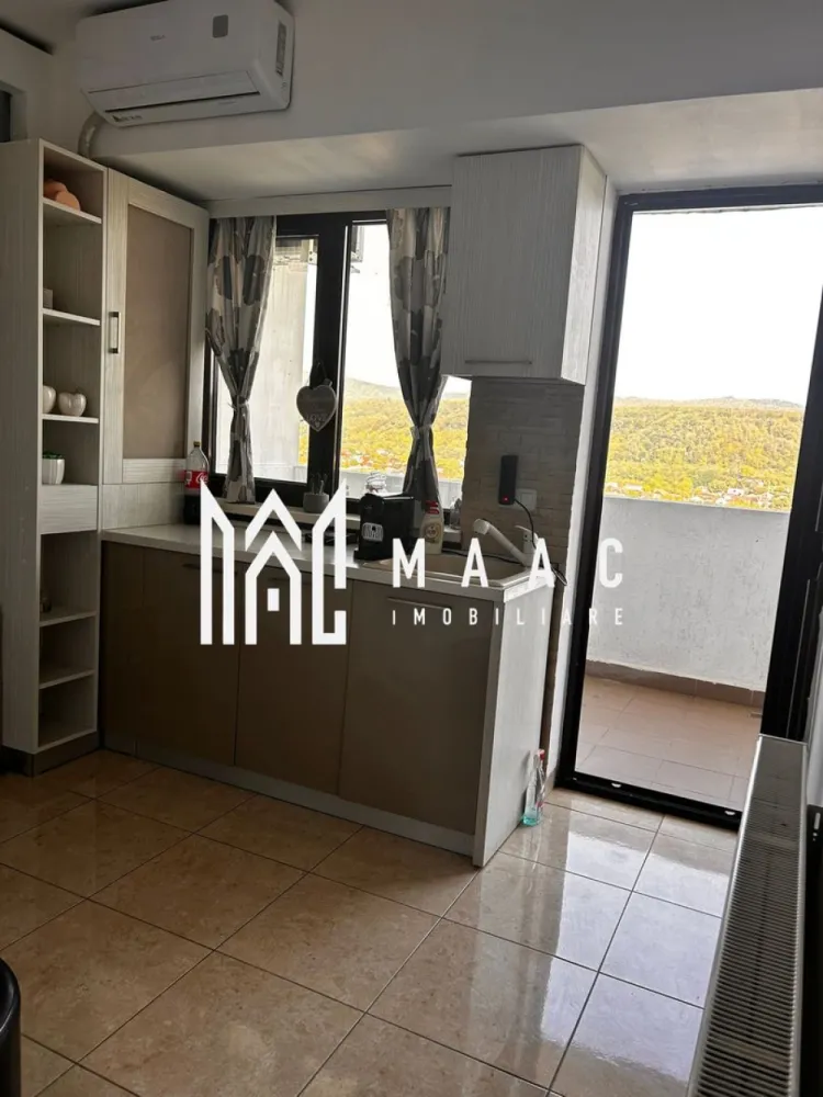 Apartament 4 Camere I Terasă 10.5 mp I Bloc nou I Ramnicu Valcea - Apartament 4 camere în bloc nou – spațiu generos și vedere deosebită în Râmnicu Vâlcea MAAC Imobiliare vă propune spre vânzare un apartament cu adevărat special, situat într-un bloc nou, la etajul 14 din 15, perfect pentru cei care caută confort, lumină naturală și priveliști impresionante. Ce îți oferă acest apartament? 66 mp utili, cu un concept inteligent: living și bucătărie open space de 30 mp, ideal pentru momente relaxante sau întâlniri cu cei dragi. 3 dormitoare spațioase (13, 12 și 7 mp), potrivite pentru odihnă și intimitate. Baie modernă Terasă de 10,5 mp, unde te poți bucura de aer curat și panorame superbe asupra orașului și râului Olt. Apartamentul este renovat, cu bucătărie delimitată și dotat cu aer condiționat pentru un plus de confort. De ce să alegi această proprietate? Bloc construit în 2015, cu spații comune moderne și bine întreținute. Două lifturi rapide pentru acces facil, chiar și în orele aglomerate. Locație excelentă, aproape de magazine, școli și mijloace de transport, cu acces rapid în toate zonele orașului. Aceasta este șansa ta să locuiești într-un apartament modern, într-o zonă dinamică, cu toate facilitățile la îndemână. Pentru detalii suplimentare, consultanță sau programarea unei vizionări, va rugăm să ne contactati specificand ID: CP2779924.